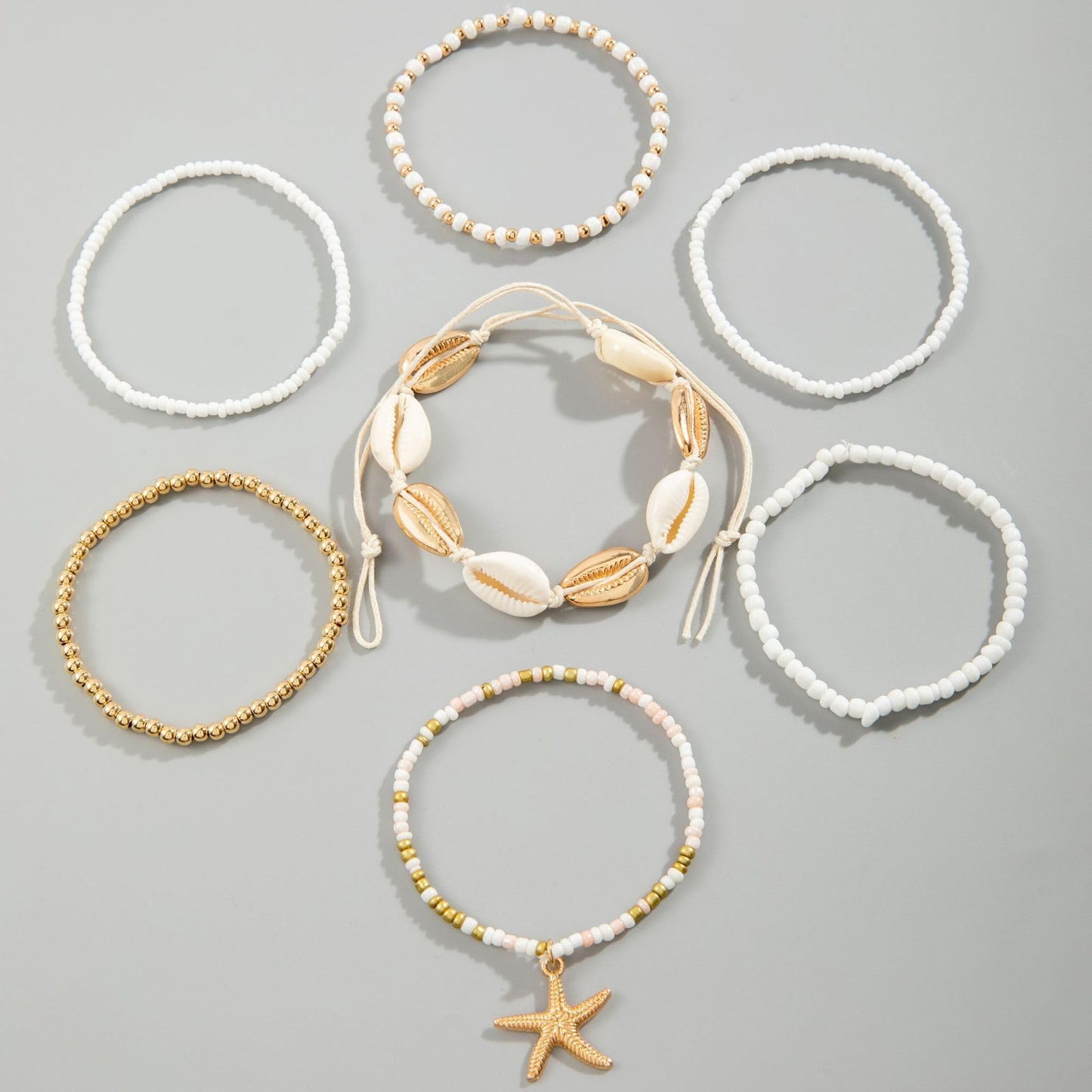 Strand Armband für Damen: 7-in-1 Style Schmuck mit Seesternen und Muscheln
